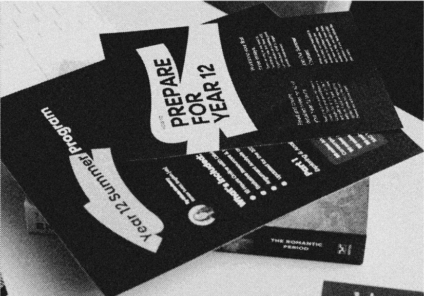 Stack of brochures on a table, with visible text stating 'Prepare for Year 12' and 'Year 12 Summer Program'.
