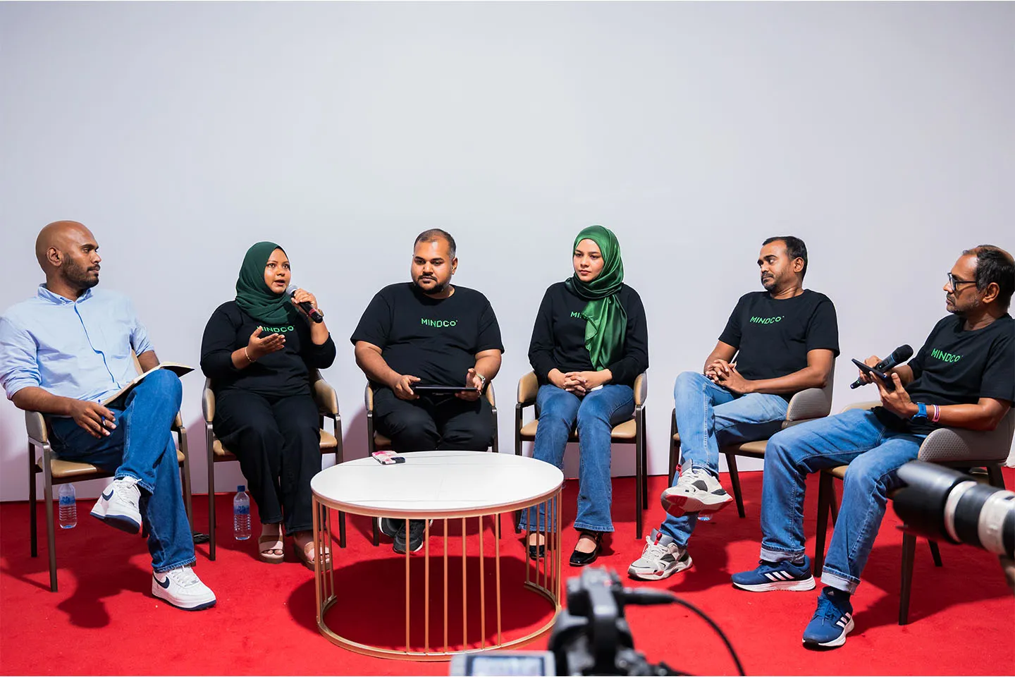Future Institute and MINDCo team members speaking at a panel discussion