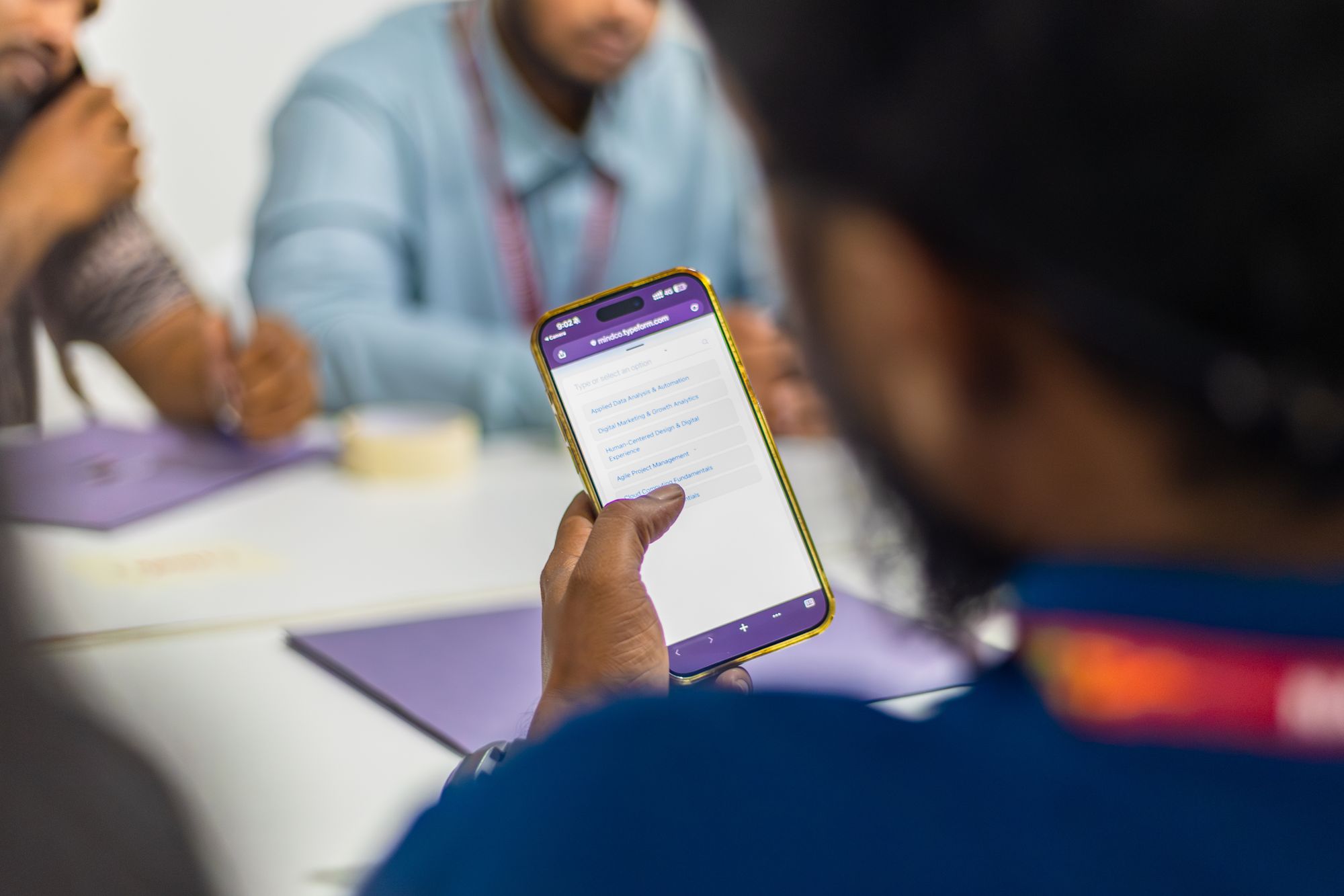 A learner using a phone during a Future Skills workshop