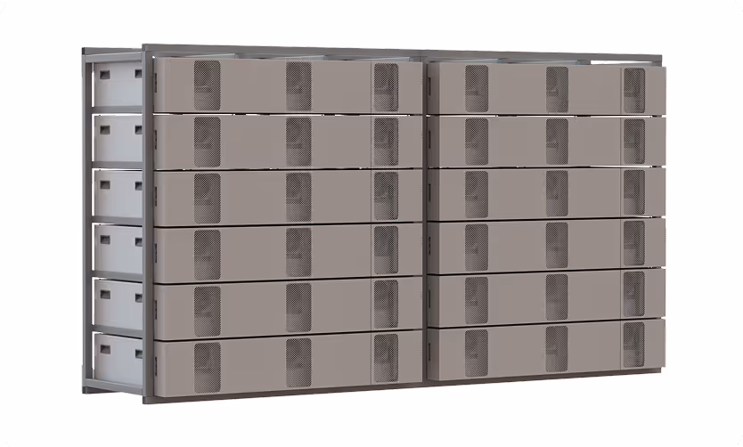 Modular stacked grey battery storage units with ventilation grilles, arranged in two large rectangular sections side by side within a metal frame.