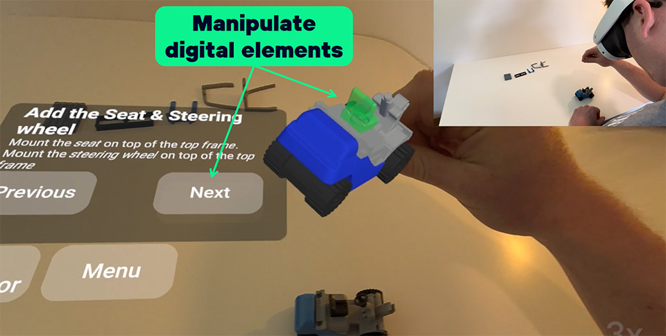 An image indicating how digitally added elements can be manipulated making use of hand tracking functionality in mixed reality.