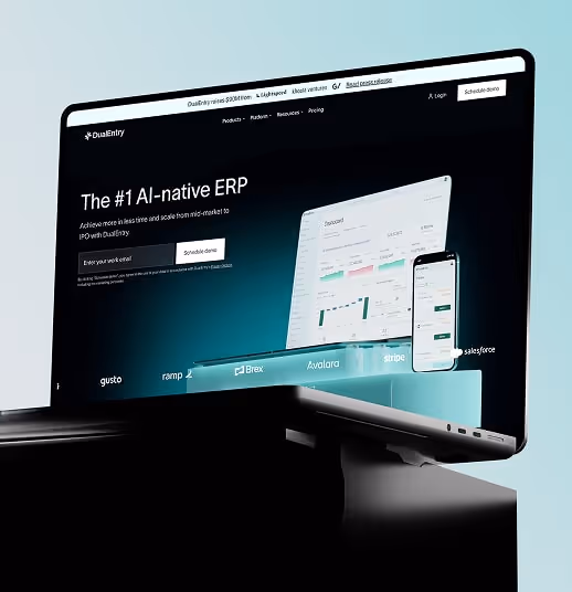 Laptop screen displaying DualEntry AI-native ERP website with dashboard and mobile interface.