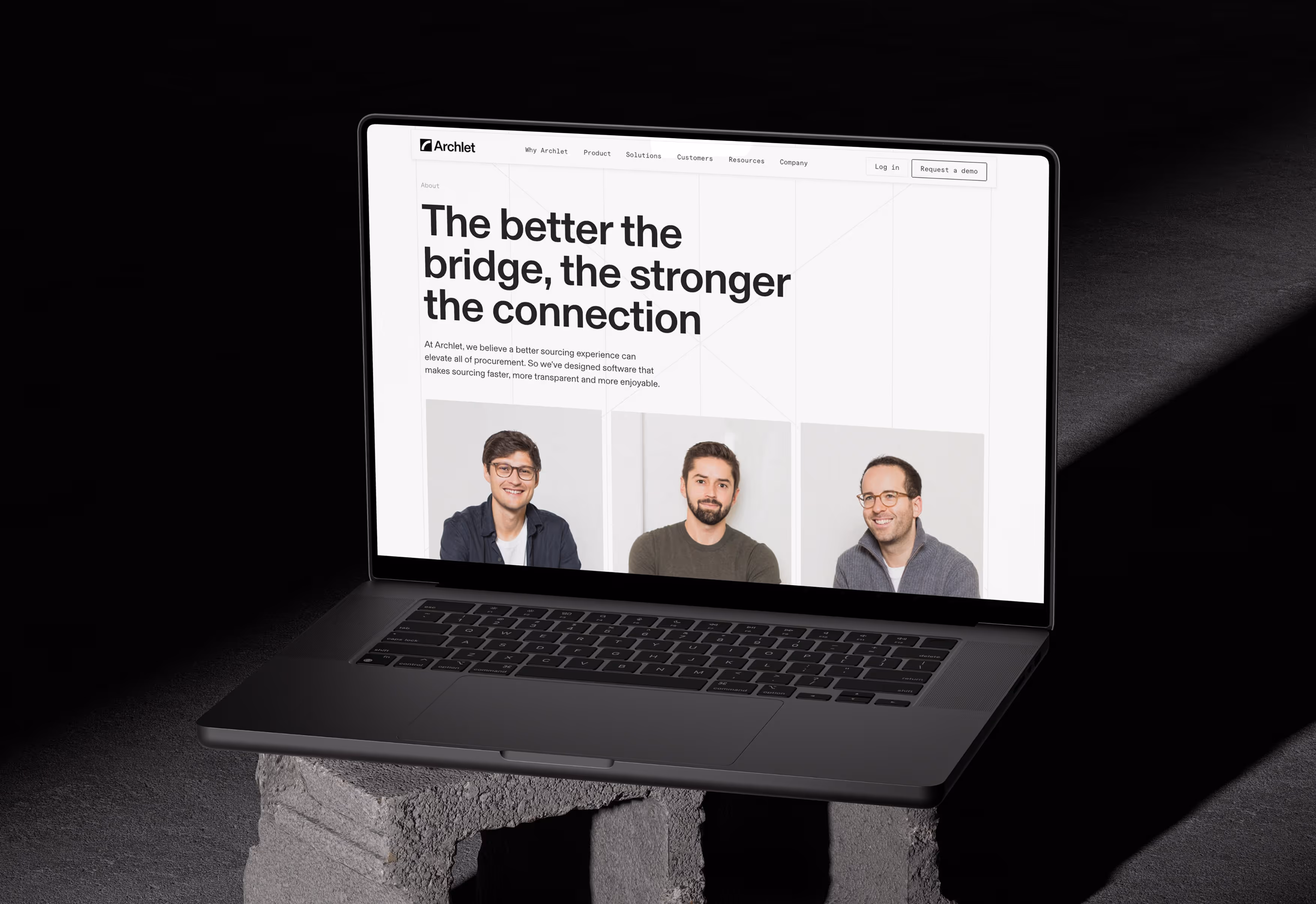 Laptop on concrete blocks displaying Archlet website with three men's portraits and text about better sourcing connections.