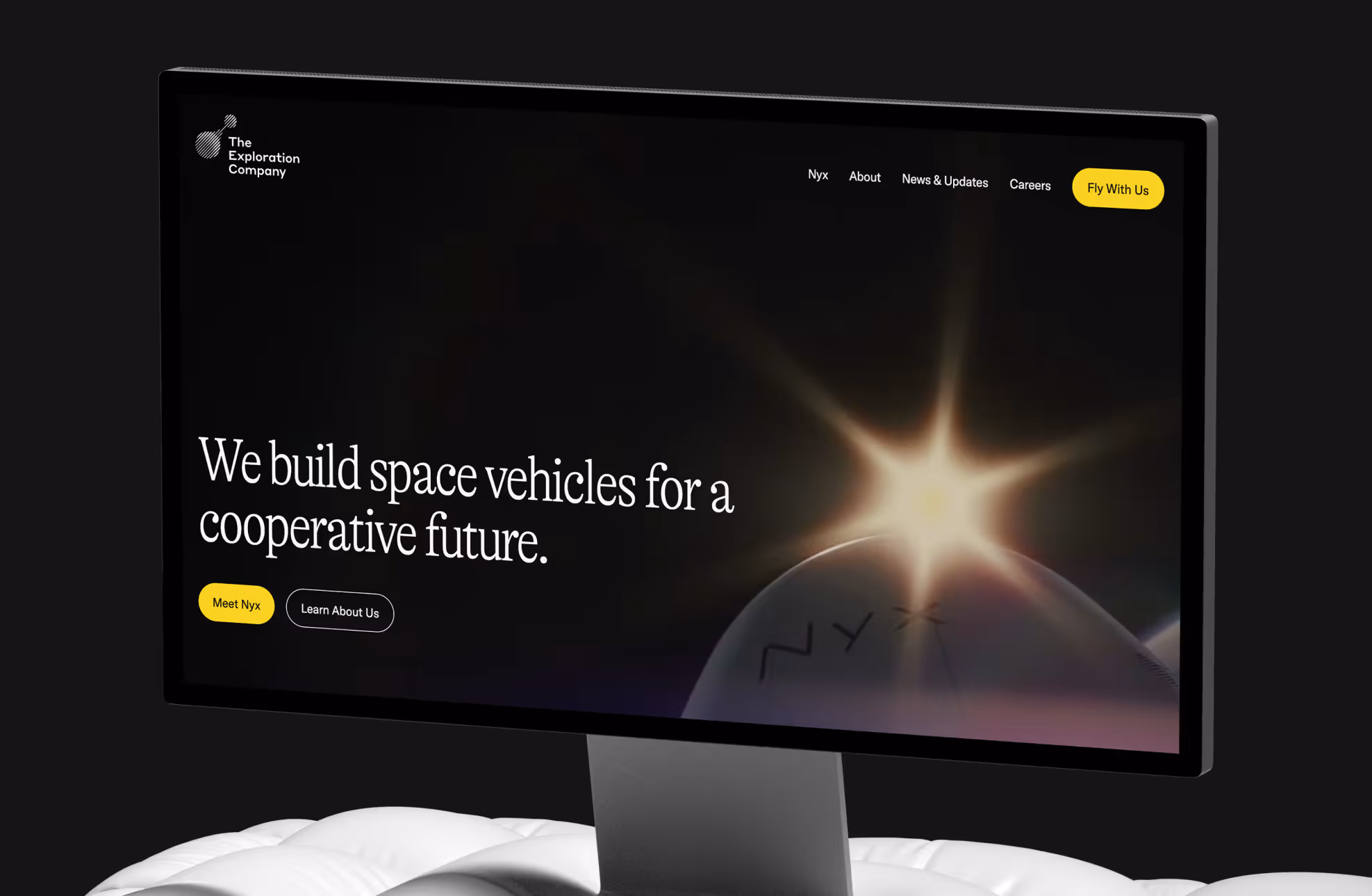 Computer screen showing The Exploration Company website with text 'We build space vehicles for a cooperative future' and a glowing sun over a spacecraft labeled Nyx.