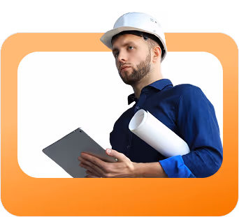 Man wearing a white construction helmet and blue shirt holding a rolled blueprint and a tablet.