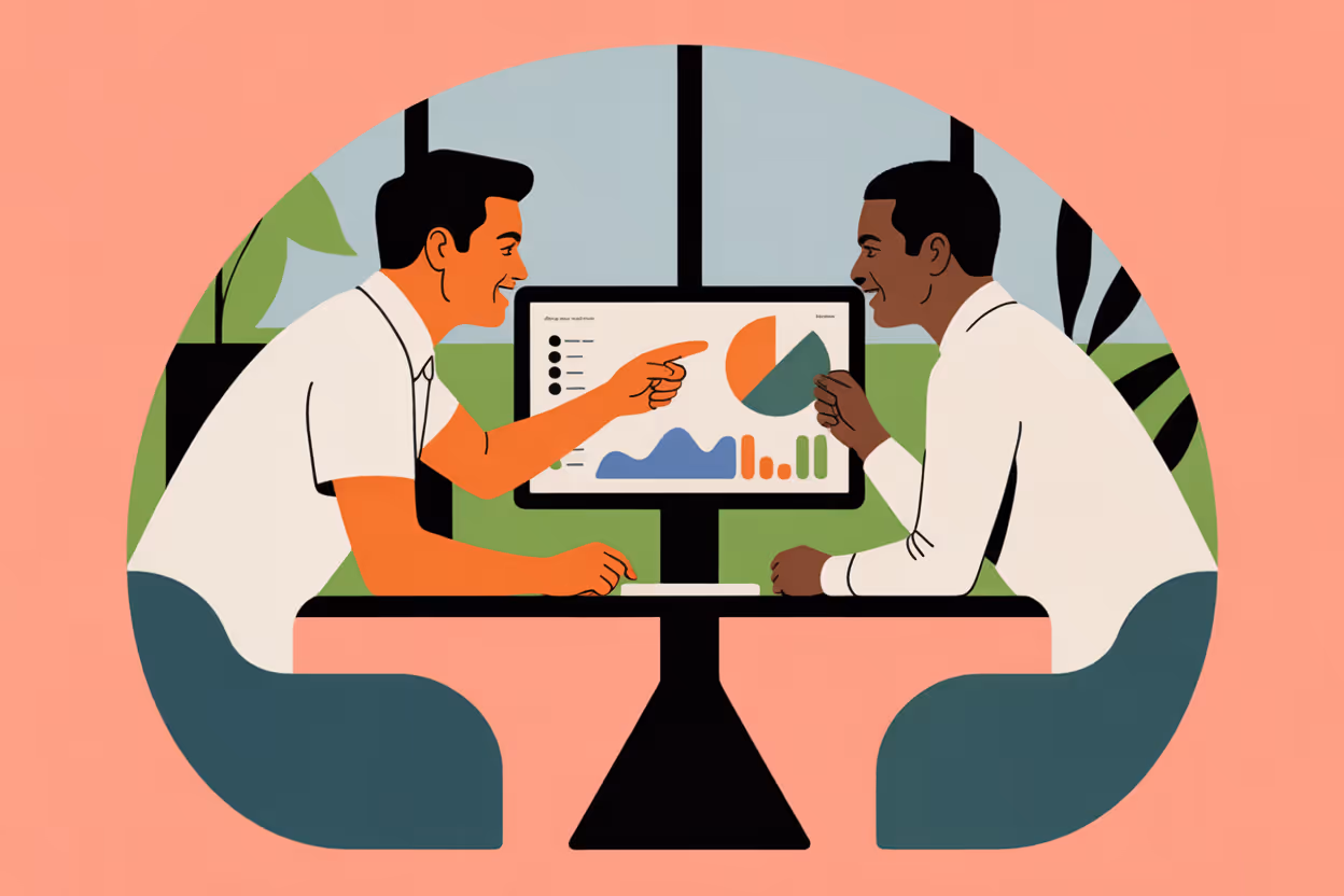 Two professionals collaborating at standing desk with monitor in bright modern office
