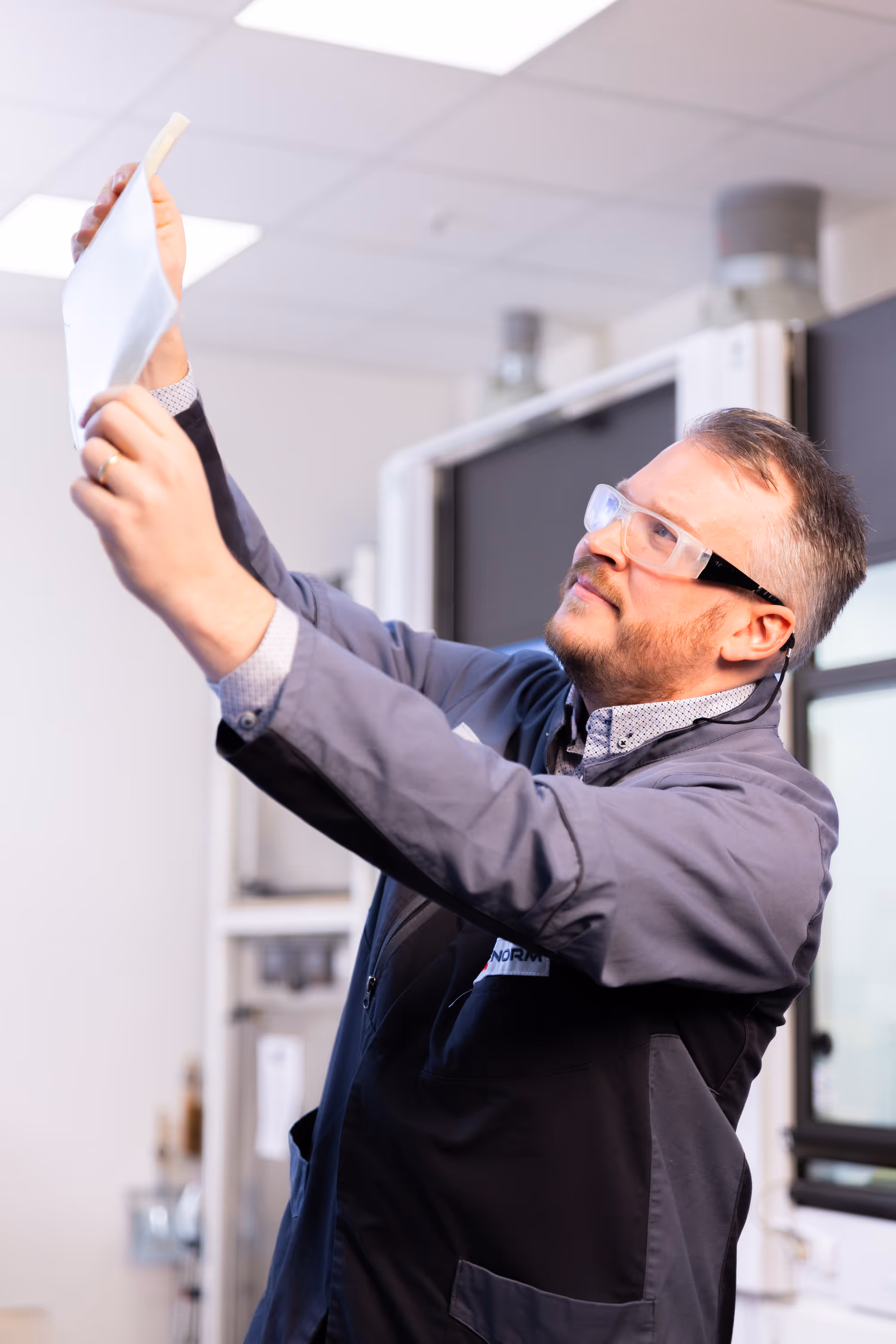 Laboratory manager checks the quality of a polyurethane sample plate