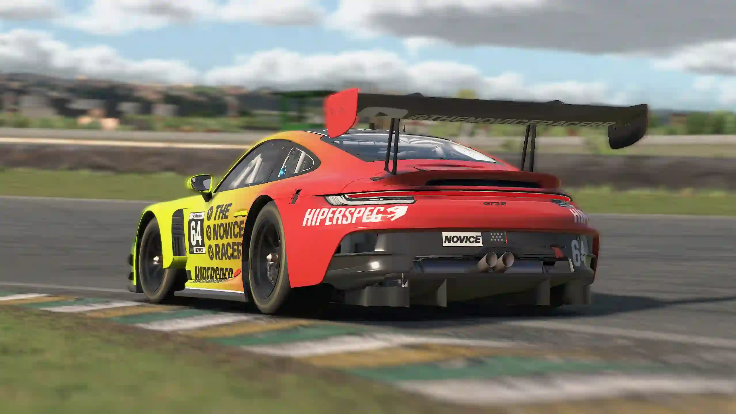 The Porsche 911 GT3 R going around a corner on iRacing.