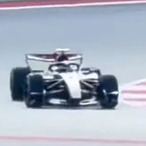 The Audi R26's front profile, shot from distance.