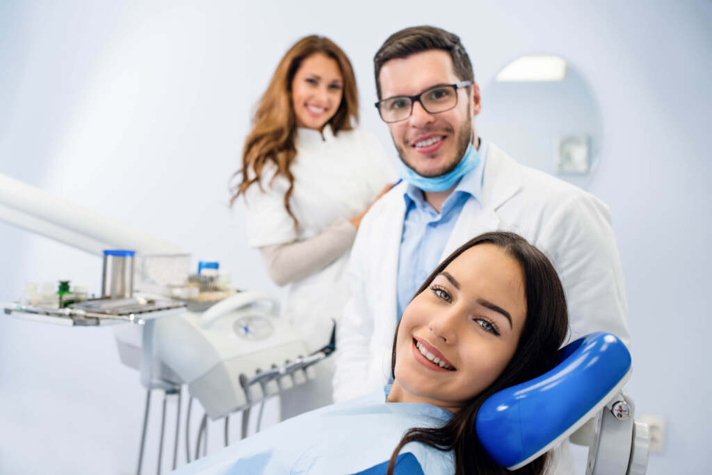 Dentist in 10458 and patient smiling