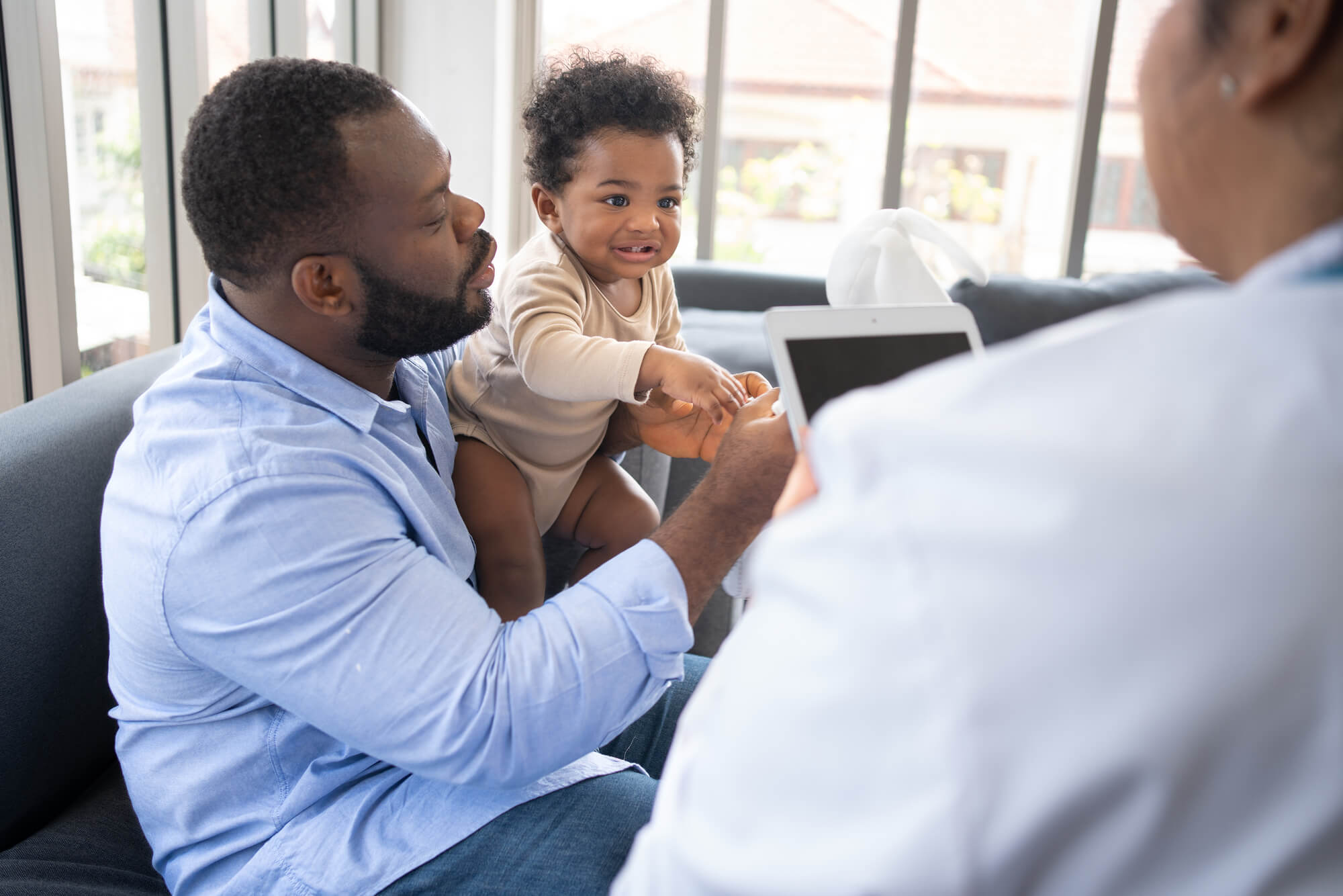 concerned dad with baby at a pediatric dentist bronx ny