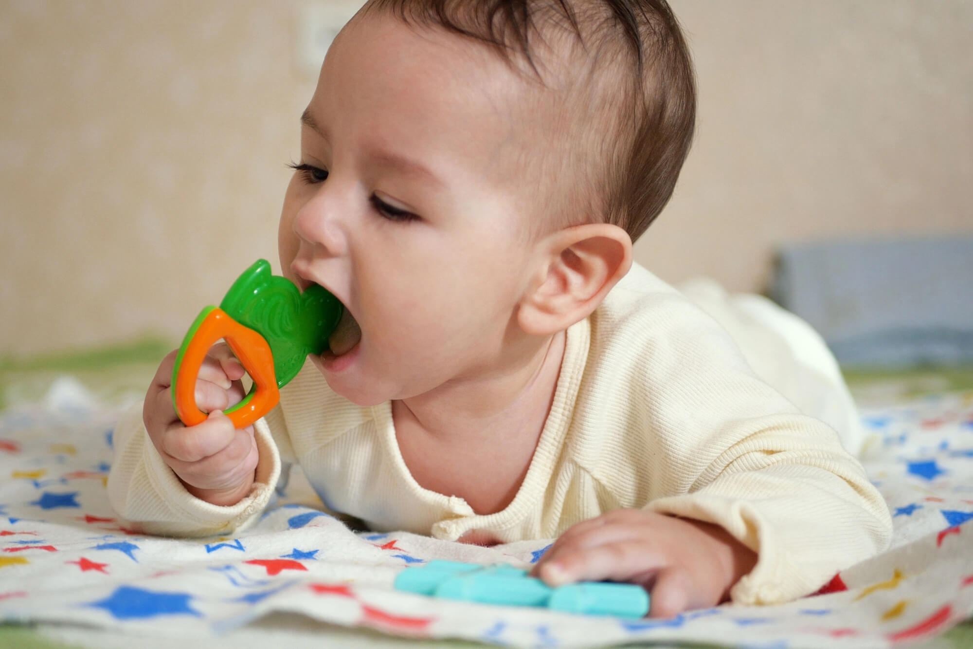 ny pediatric dentistry toddler playing with teething toy