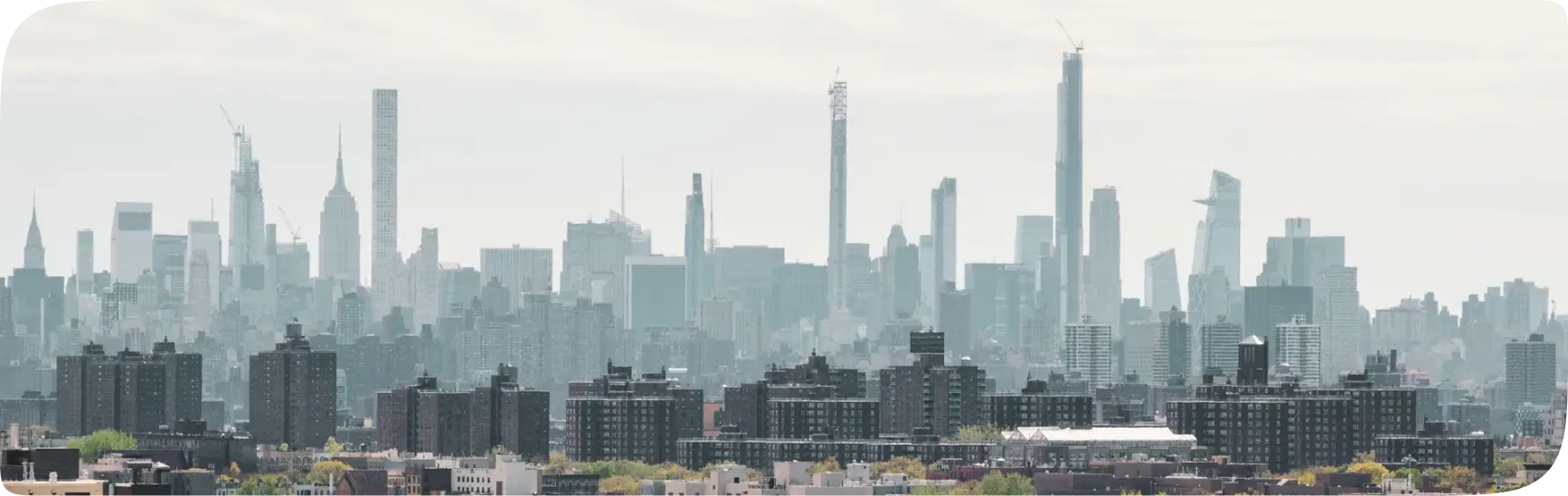 a view of a large city with tall buildings