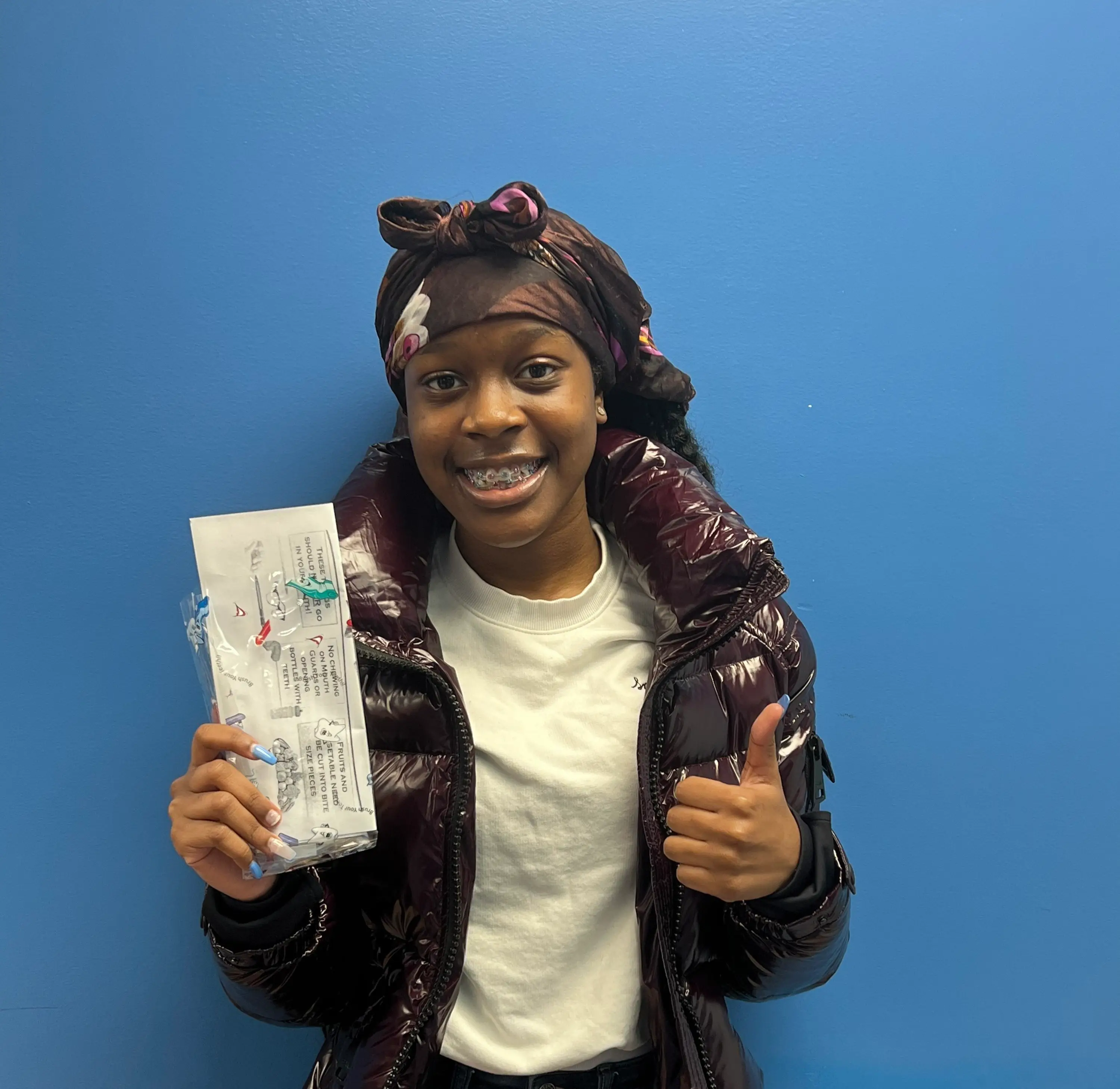 a woman holding a piece of paper in her hands