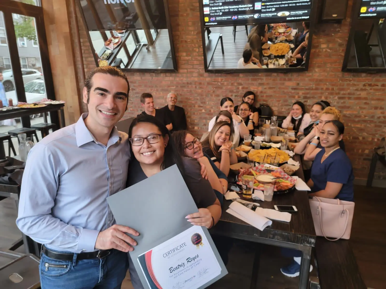 a group of people sitting around a table