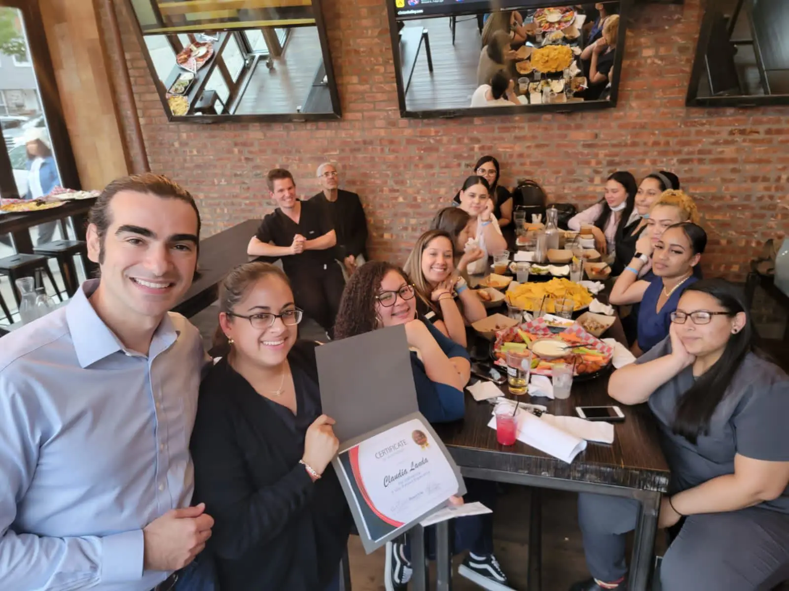 a group of people sitting around a table