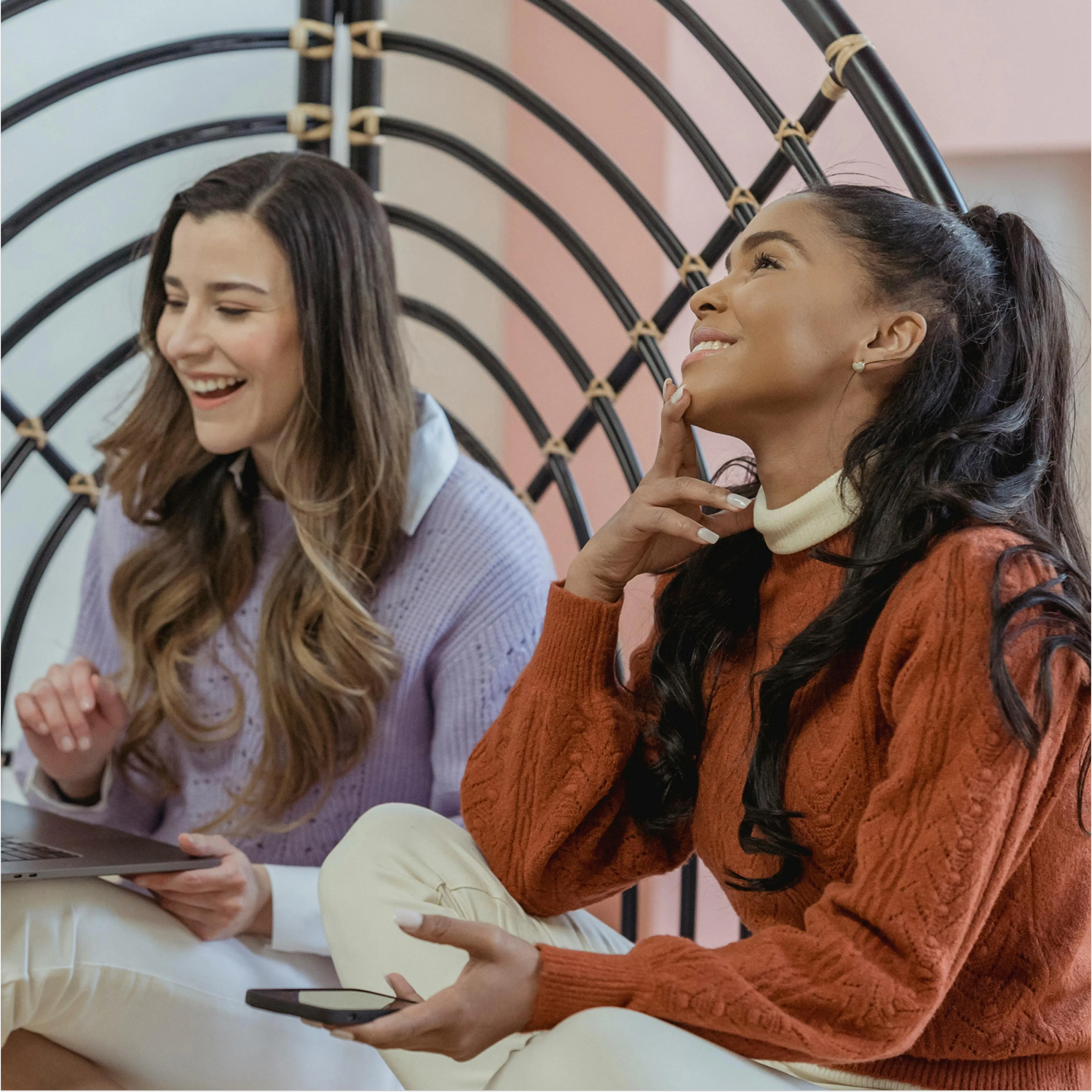 Two women in a meeting, laughing