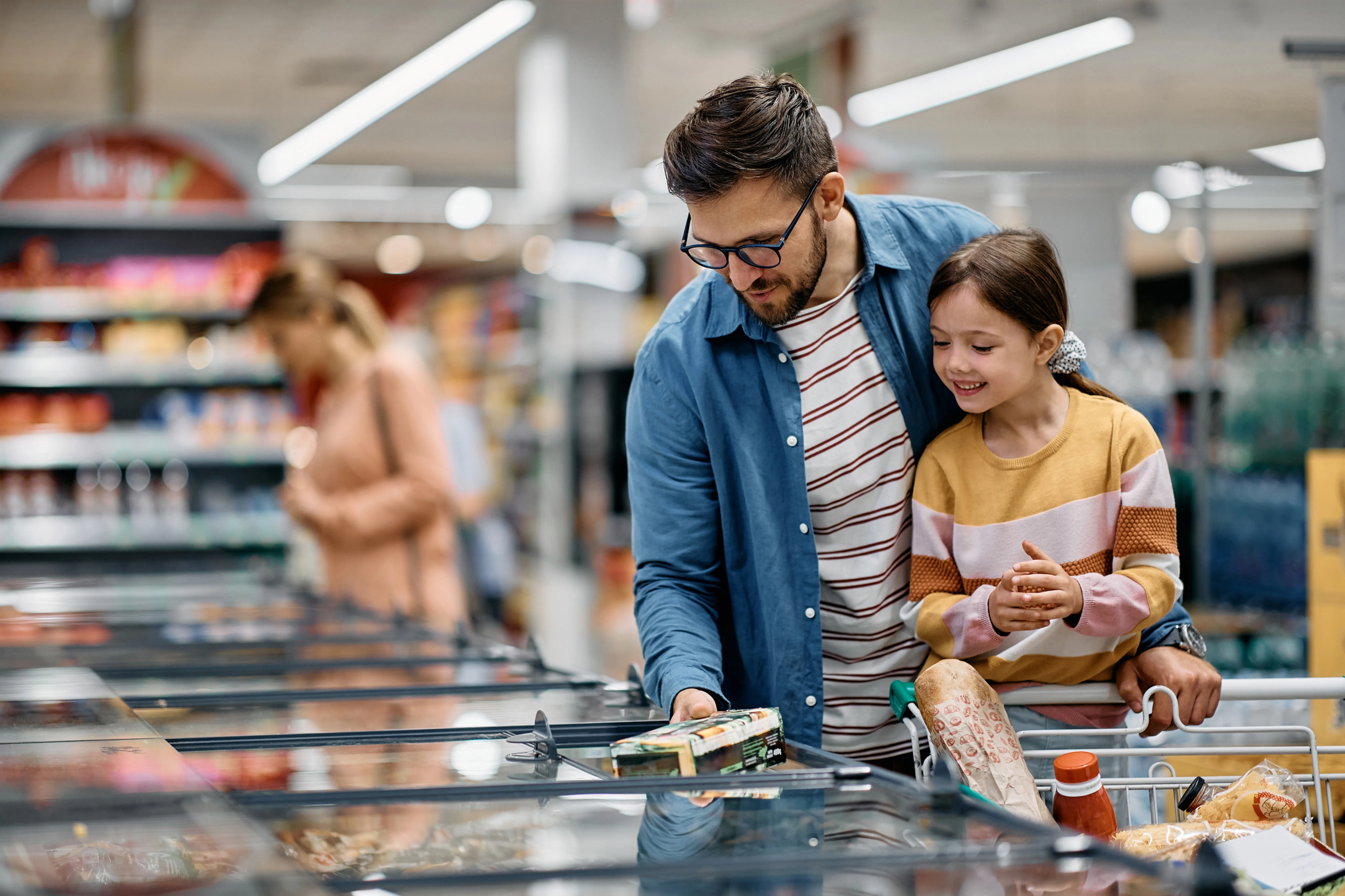 A father and child doing groceries
