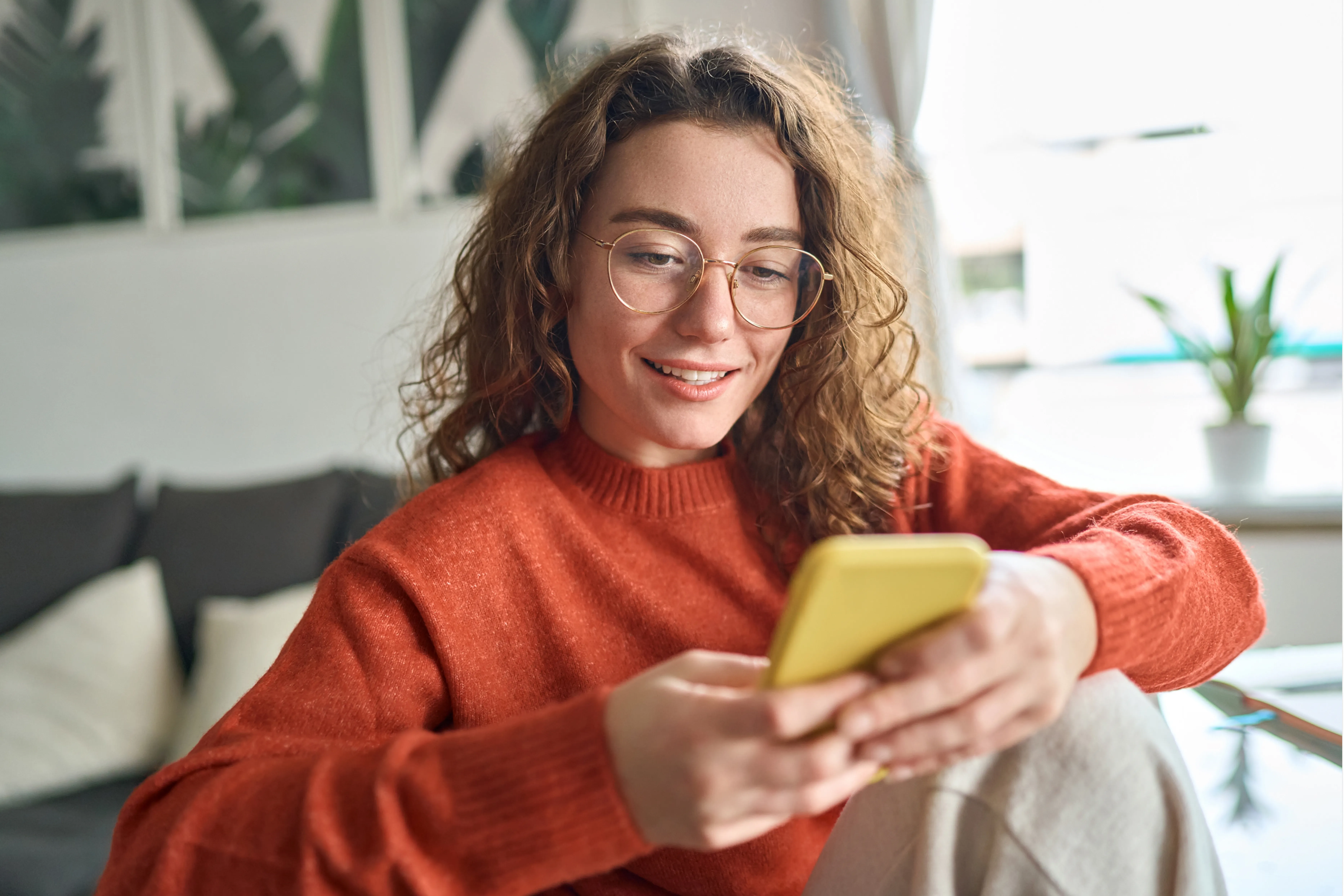 A woman holding a phone