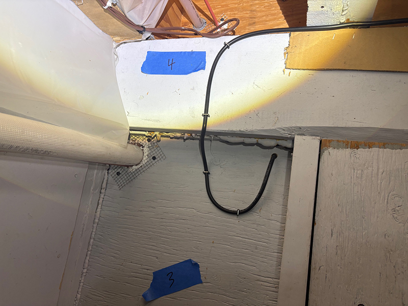 Rodent access holes sealed using copper mesh, caulking, and stainless steel wire mesh backing.