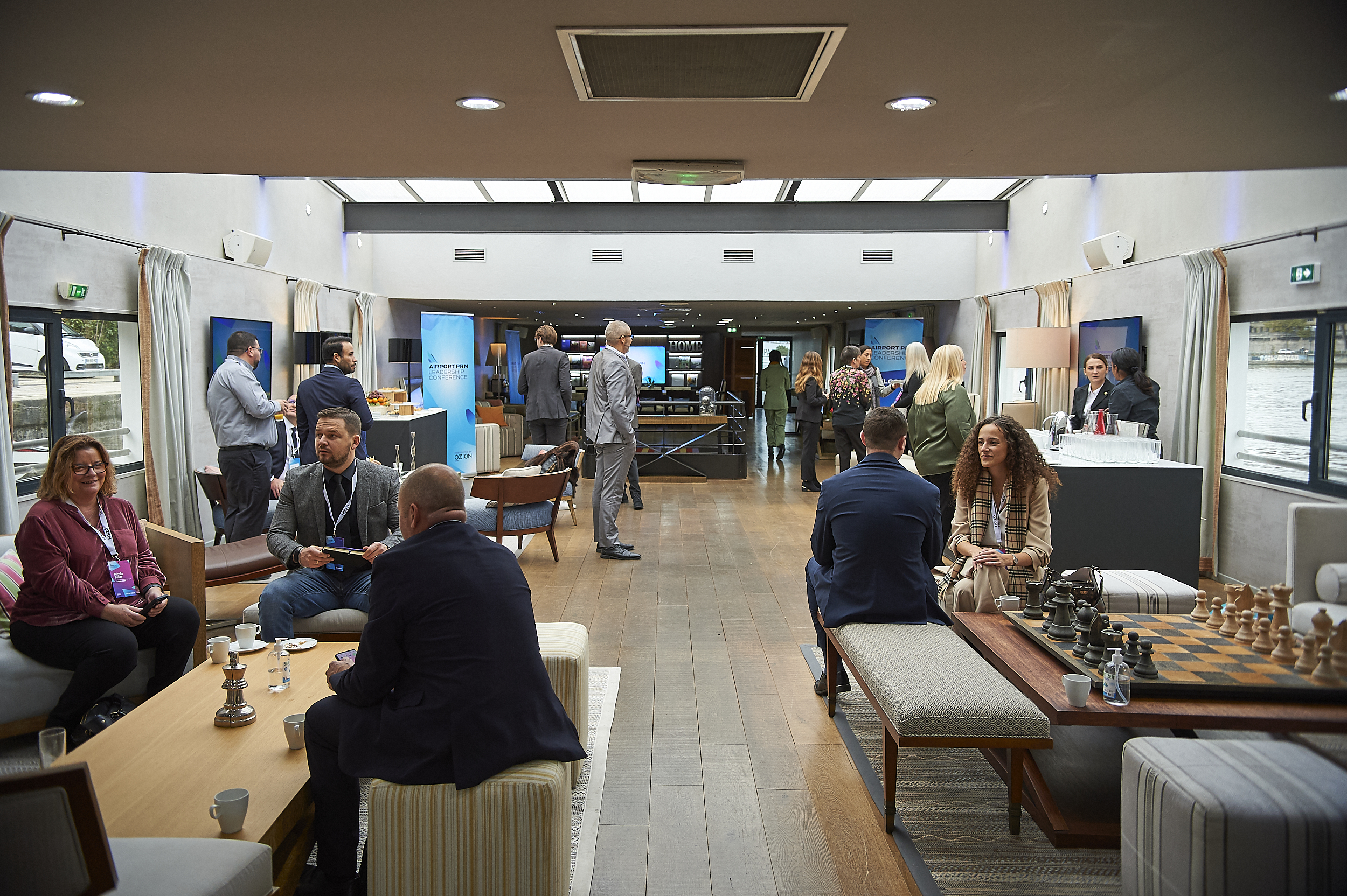 Delegates networking inside the Airport PRM Leadership Conference venue on the Seine, Paris 2023