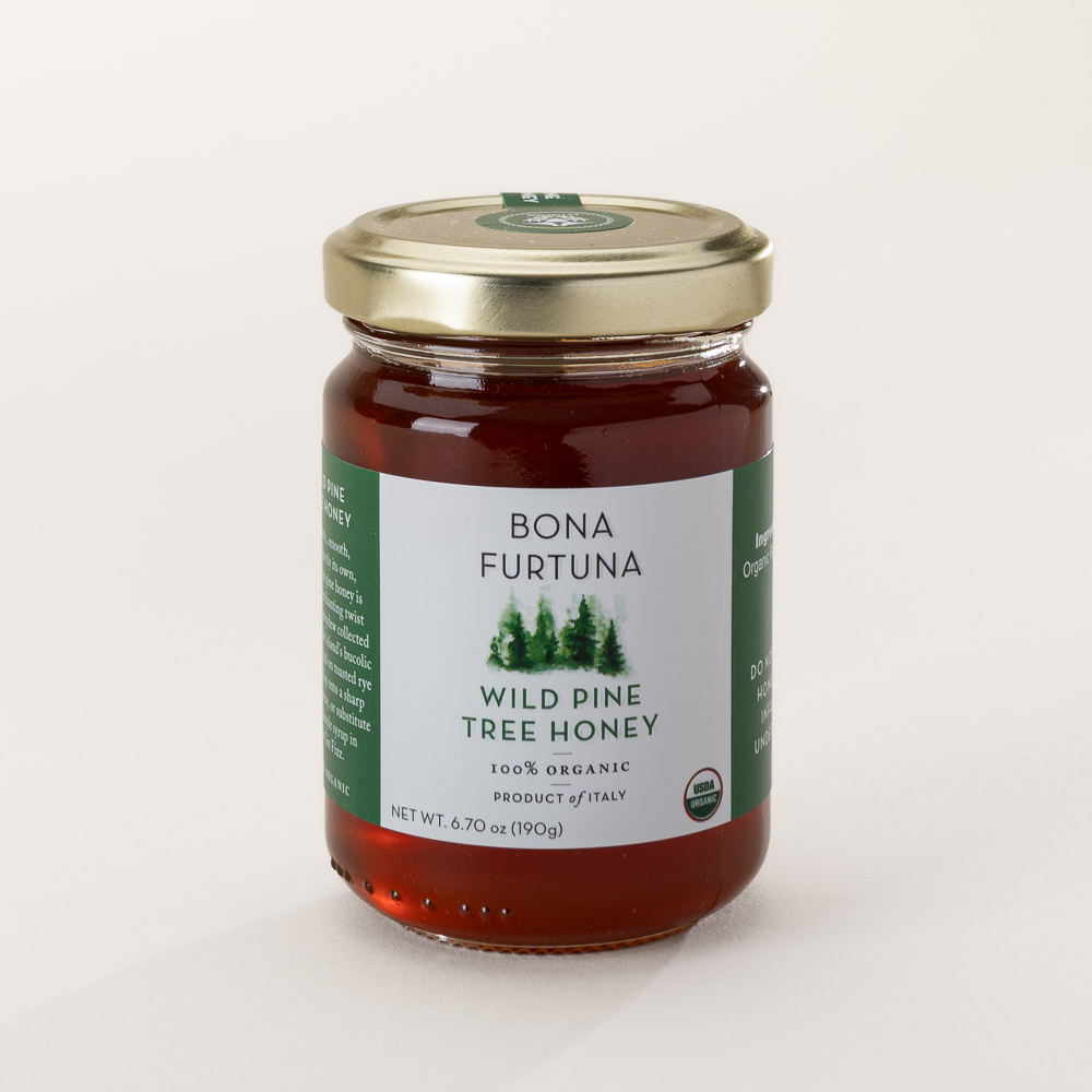 Organic wild pine honey collected from a protected apiary in Sicily's forest preserves