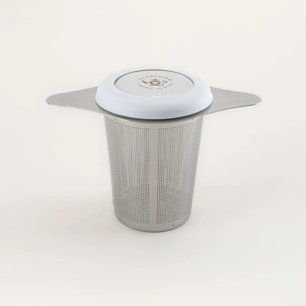 Laser-cut stainless steel tea infuser and coaster-style lid