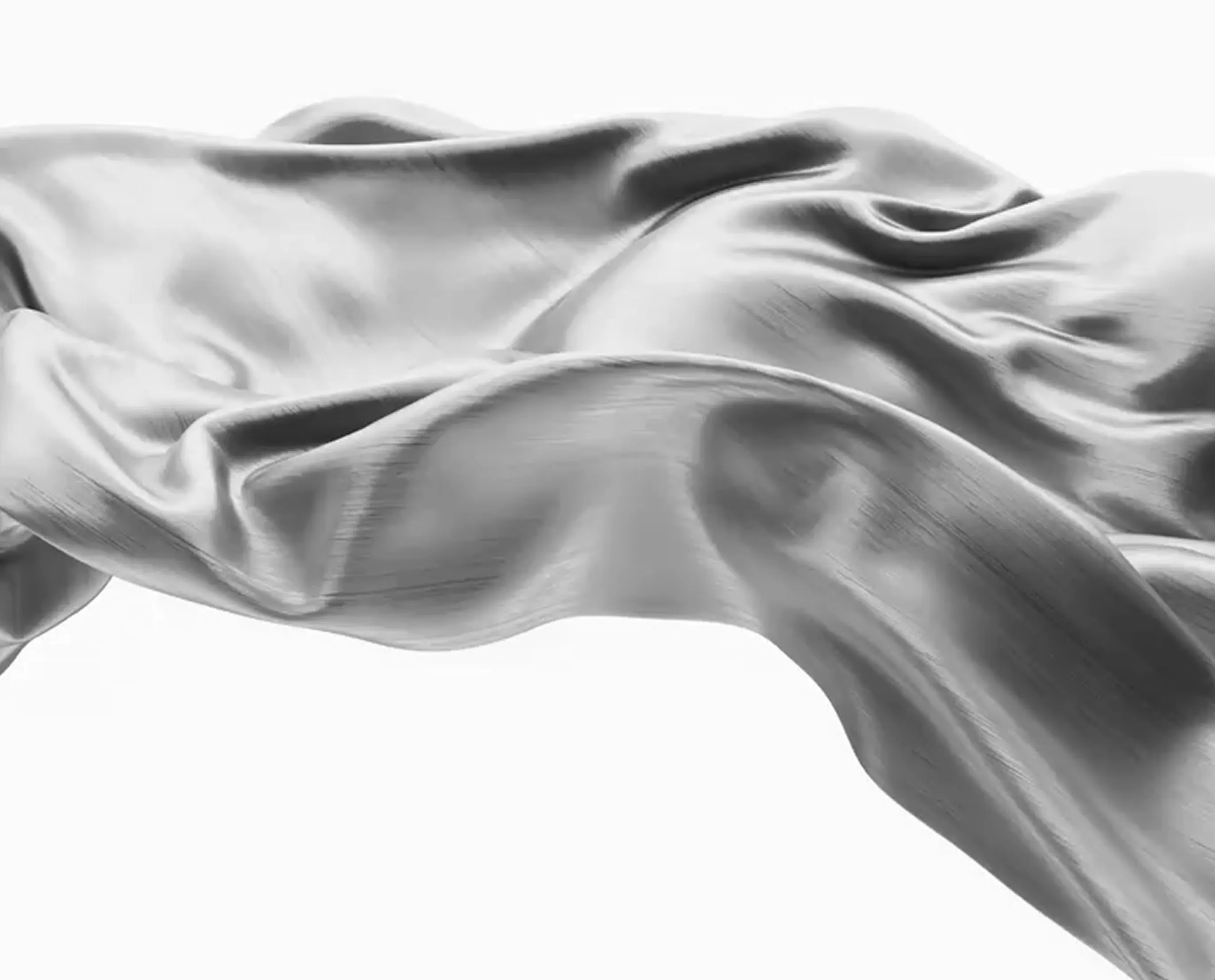Smooth, flowing piece of silver-grey silk fabric with gentle folds and highlights.