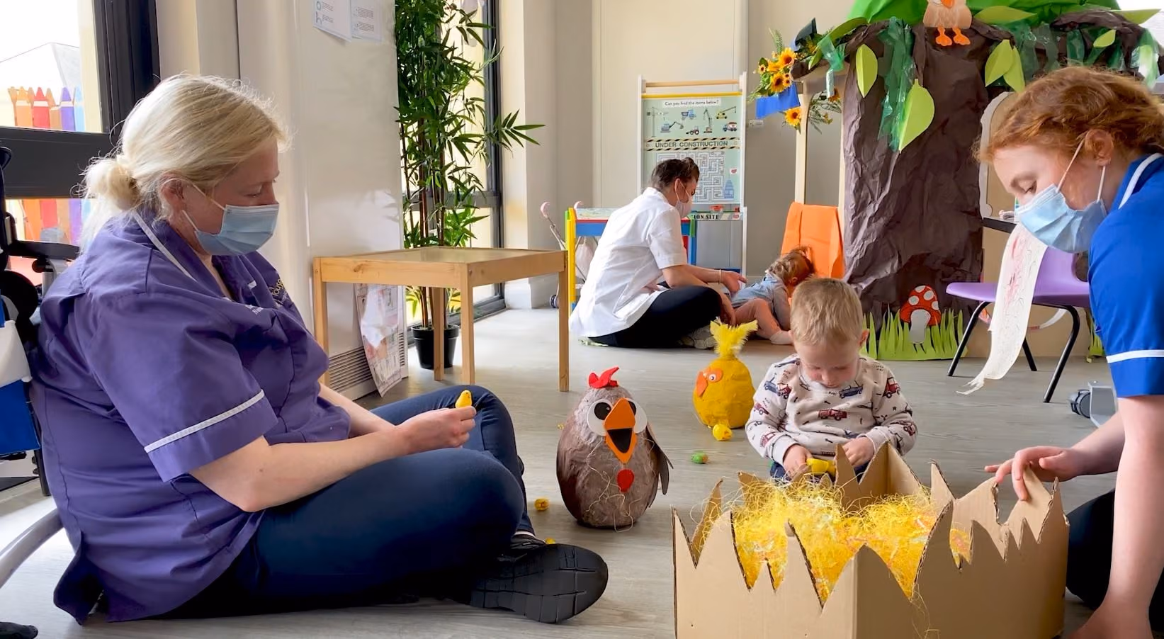 Rebecca House nurses playing with children