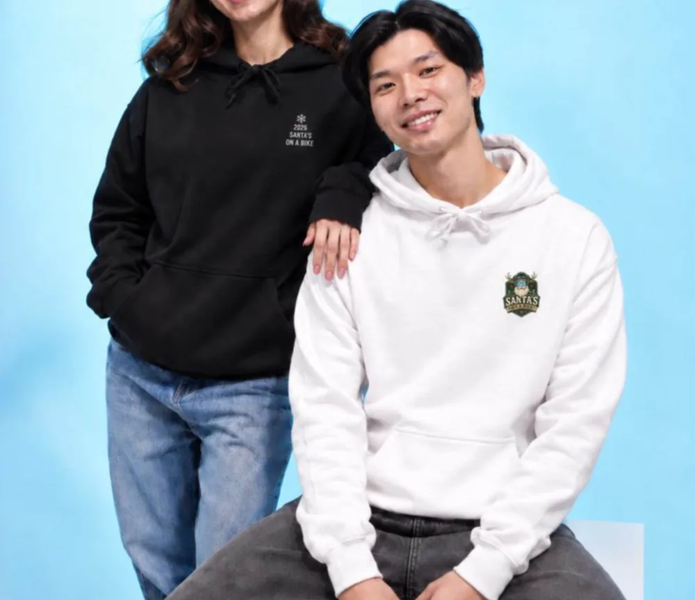 Two people wearing Santa's on a Bike hoodies