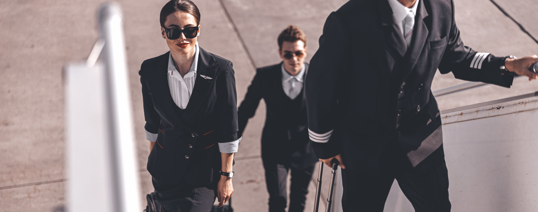 Pilots and cabin crew walking together through the airport