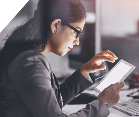 Woman in glasses working on a tablet