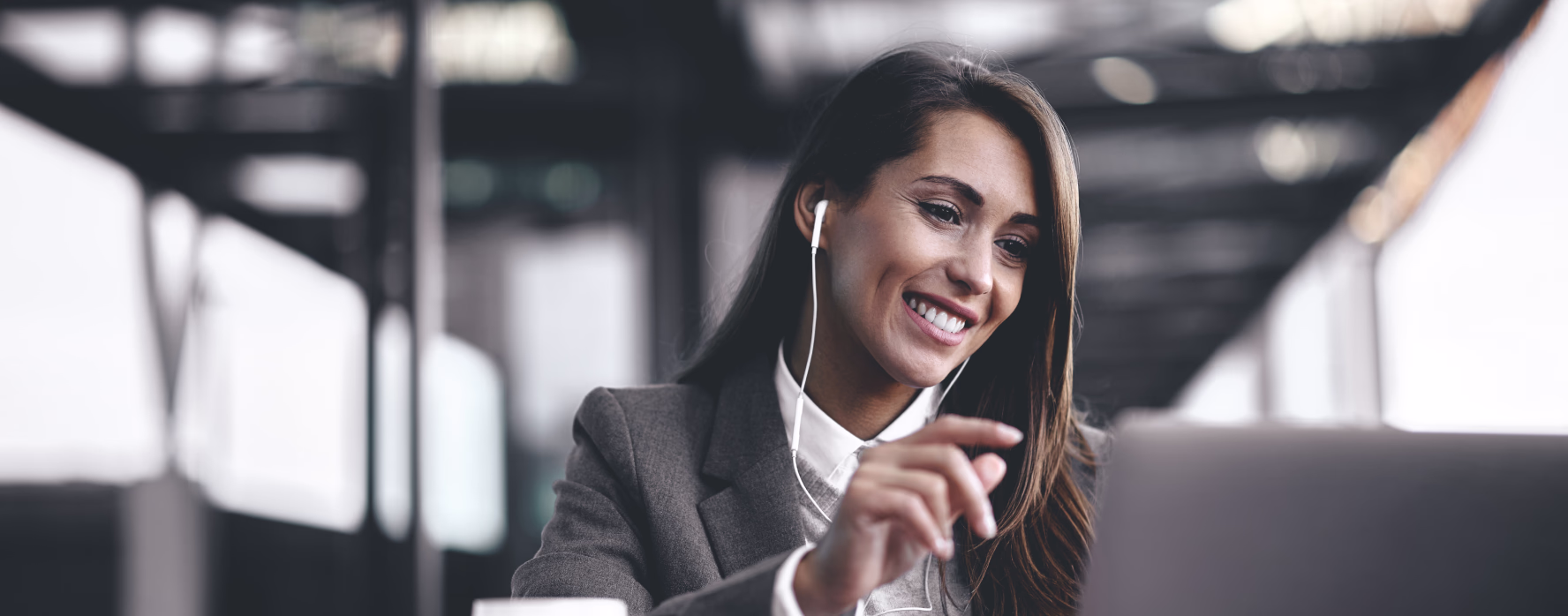 Smiling businesswoman working at a desk in an office