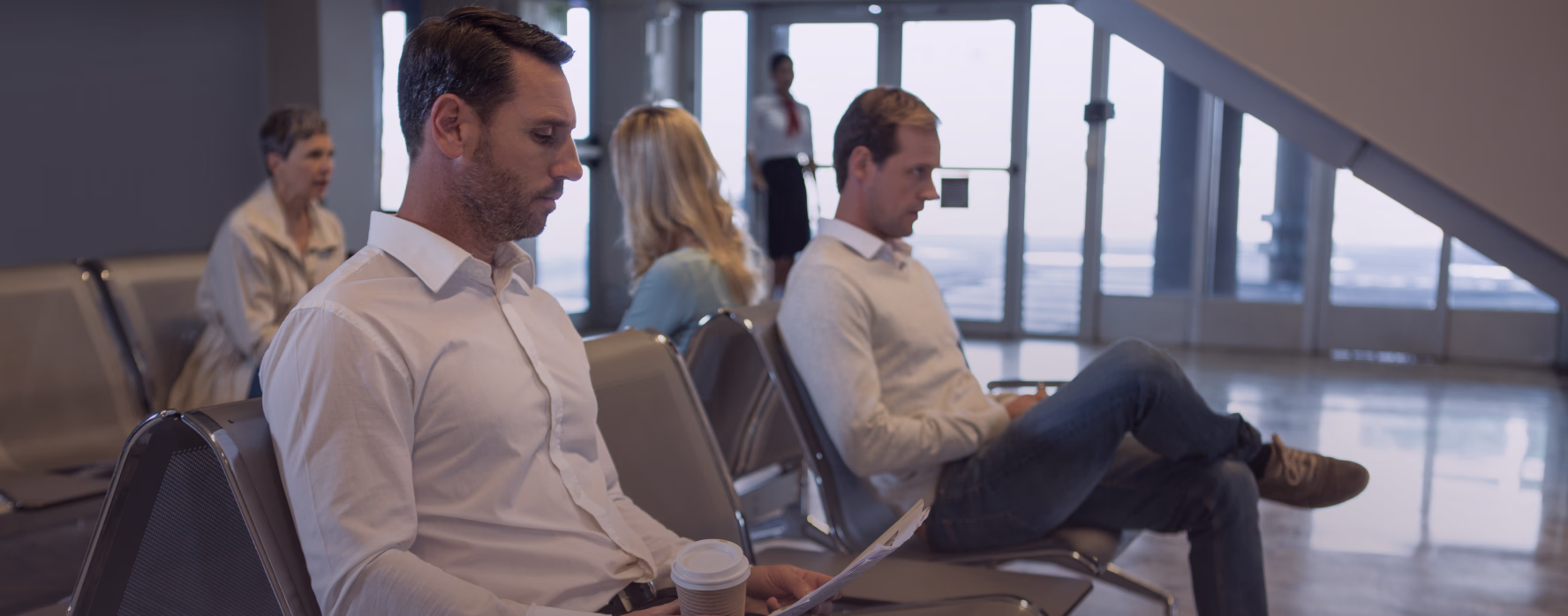 Passengers waiting at the departure gate