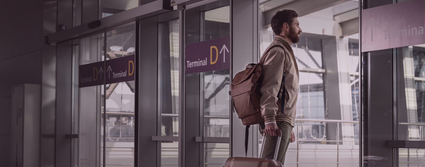 Traveller with a backpack walking through an airport