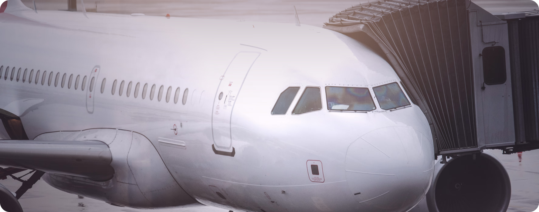 Passenger aircraft at the gate with the jet bridge attached
