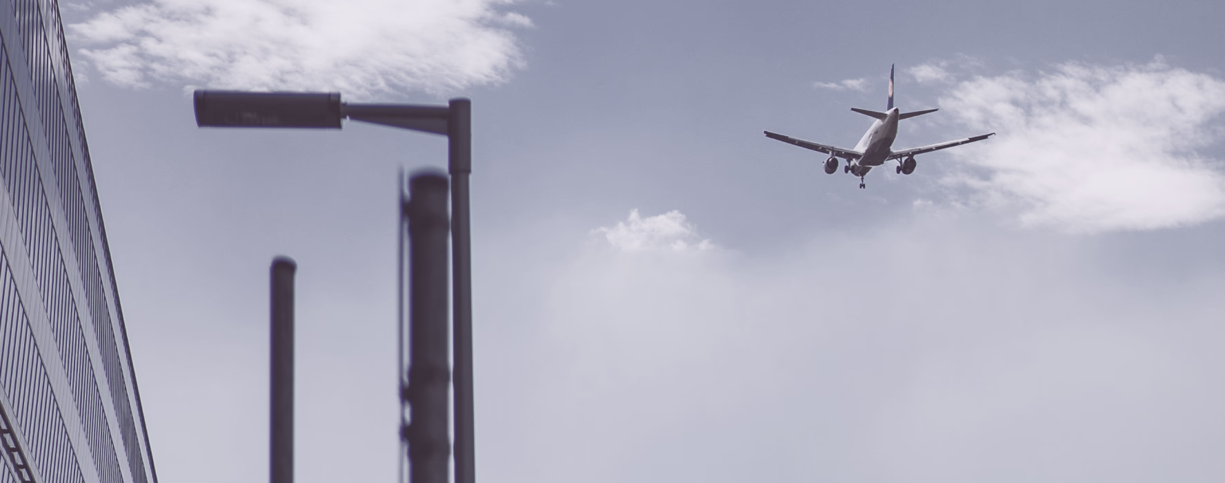 Aircraft taking off above airport floodlights