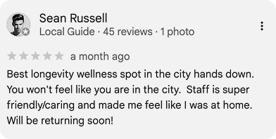 A positive five-star Google review by Sean Russell praising a wellness spot for its friendly staff and home-like feel.