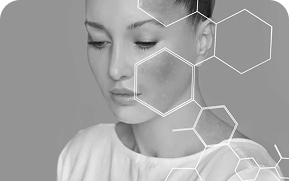 Black and white close-up of a woman with hexagonal graphics overlay on her face and shoulder.