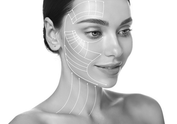 Portrait of a woman with facial contour lines illustrating areas for cosmetic or dermatological treatment.