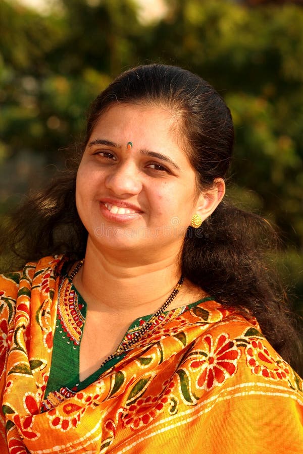 Smiling Indian businesswoman used to represent Divya Arora, a 47-year-old entrepreneur navigating menopause and stress with support from VinayakM