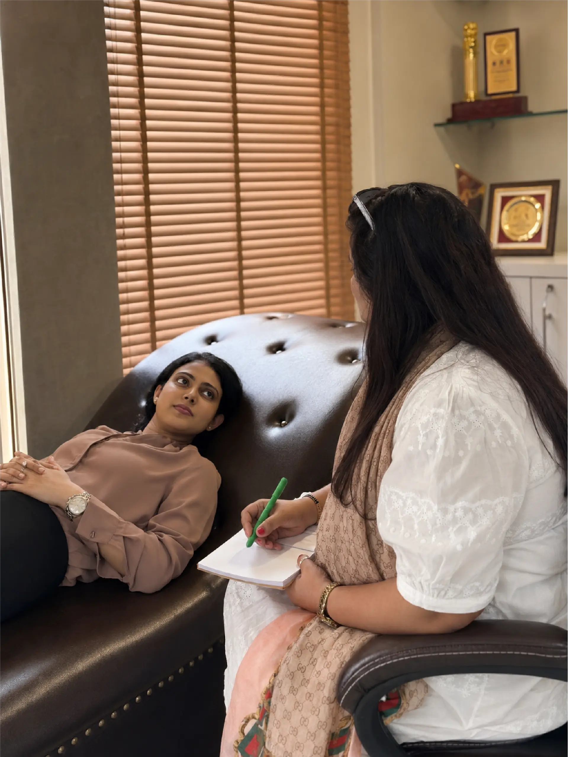 Illustration for Step 2 with a counsellor listening as a woman shares her story, so the care plan respects her real life and constraints