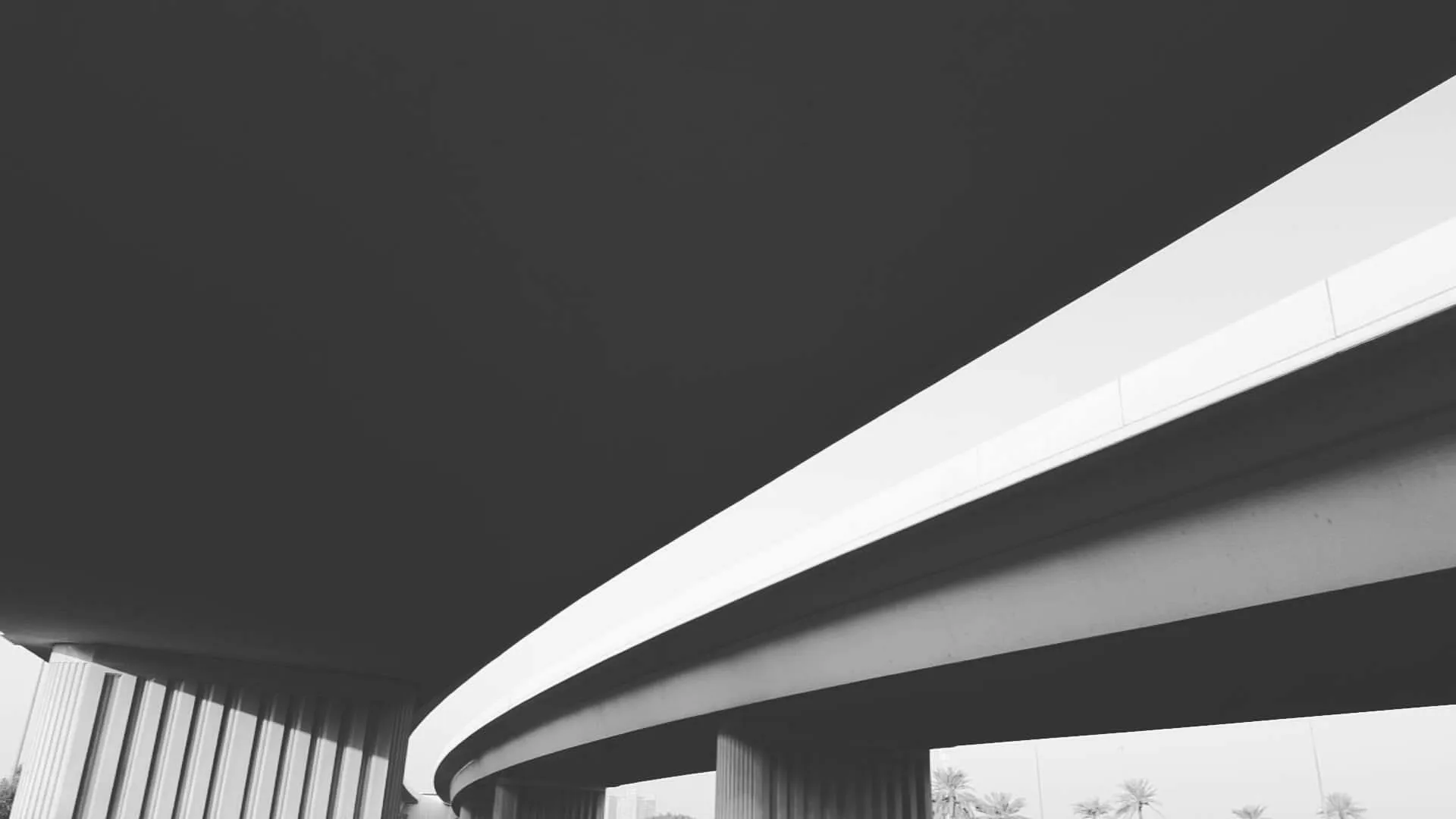 Abstract black and white image of concrete bridge.