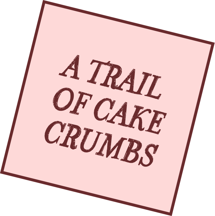 Square paper note tilted with the text 'A TRAIL OF CAKE CRUMBS' in brown on a pink background.