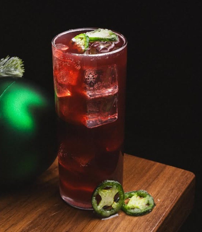 a christmas themed cocktail next to a ornament