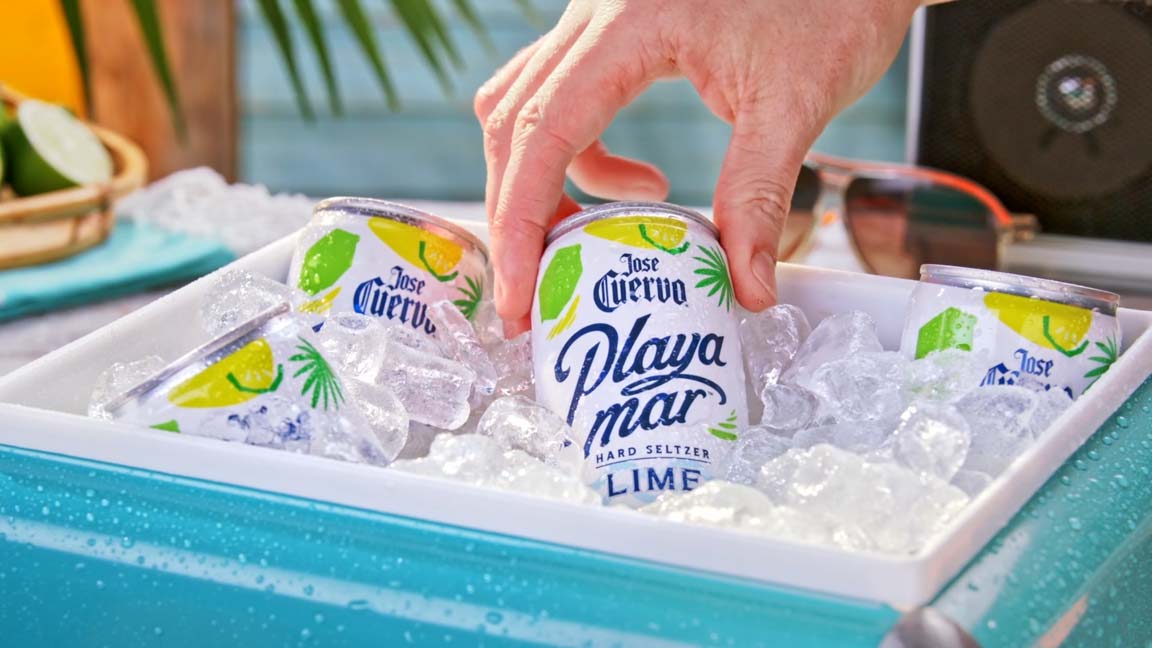 Jose Cuervo Playa Mar lime hard seltzer cans on ice in a beach cooler — custom tabletop beverage production by Big River Film Co., capturing vibrant summer lifestyle visuals for food and drink marketing campaigns.