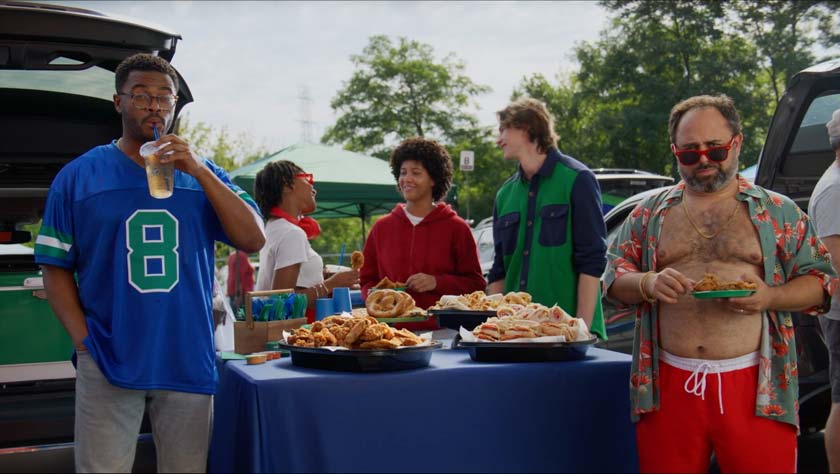 Tailgate party scene from the Royal Farms ROFOMO campaign — friends enjoying chicken, subs, and drinks at an outdoor food spread, filmed by Big River Film Co. using high-end studio and motion control production.