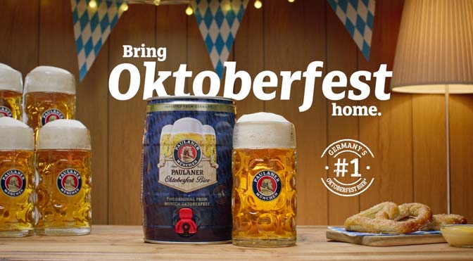 Paulaner Oktoberfest beer tabletop scene styled by Big River Film Co., featuring frothy steins, a mini keg, and fresh pretzel in a warm Bavarian-inspired set designed for premium food and beverage advertising.