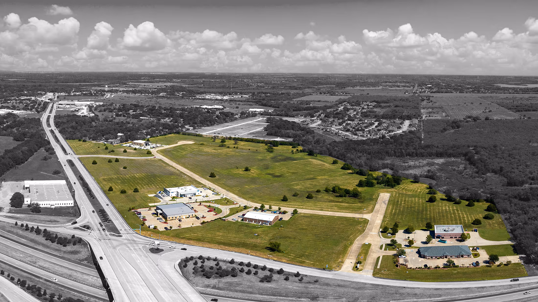 Discover Prairie Creek Crossing Business Park, premier commercial property available in Kaufman, Texas. Aerial drone footage showcases the site's strategic location, available acreage, and development potential in the heart of Kaufman County.