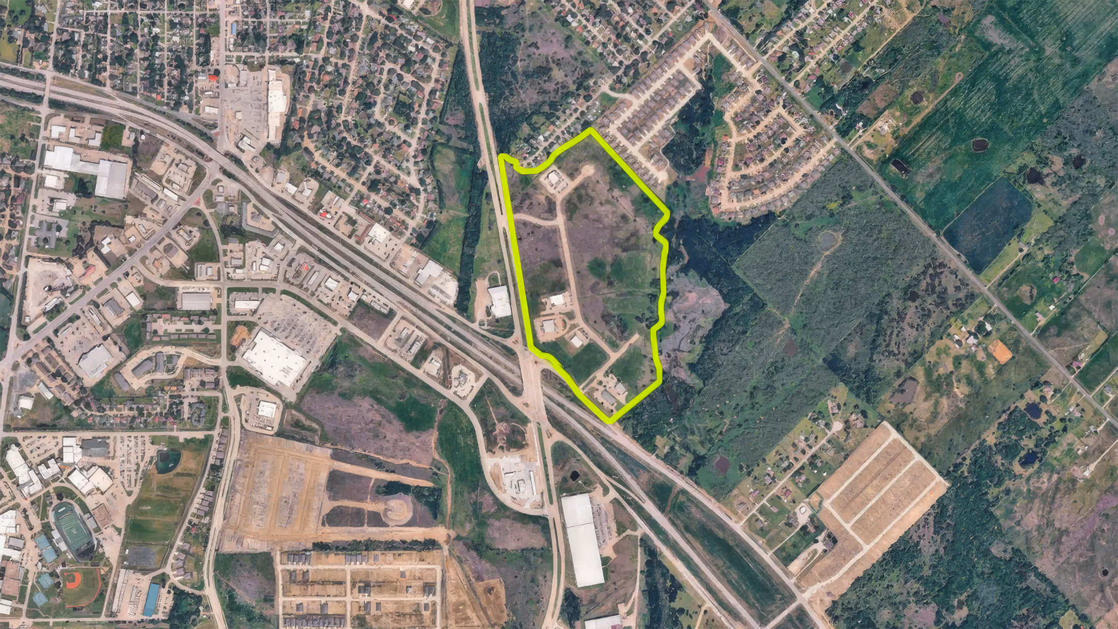 Explore Prairie Creek Crossing Business Park, a premier commercial property available in Kaufman, Texas. Aerial drone footage captures the site's prime location, acreage, and development potential in the heart of Kaufman County.